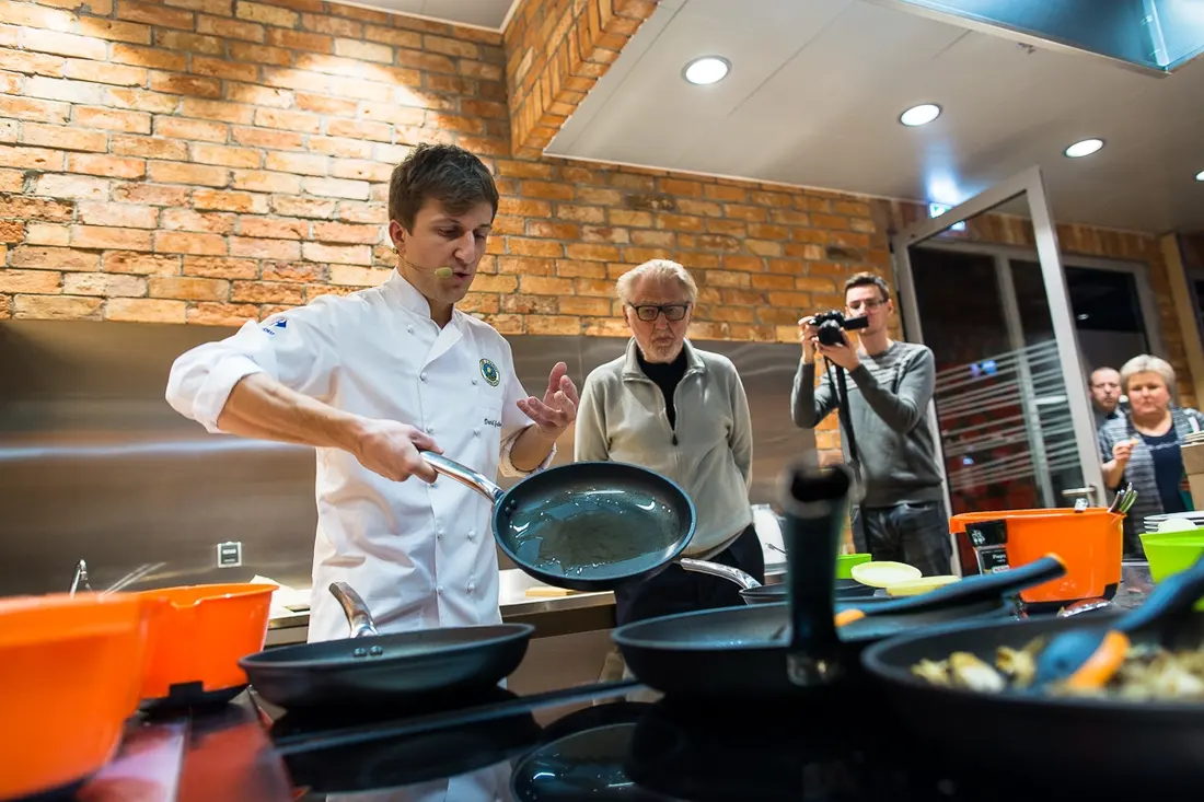 A chef cooking live at a Carrefour opening